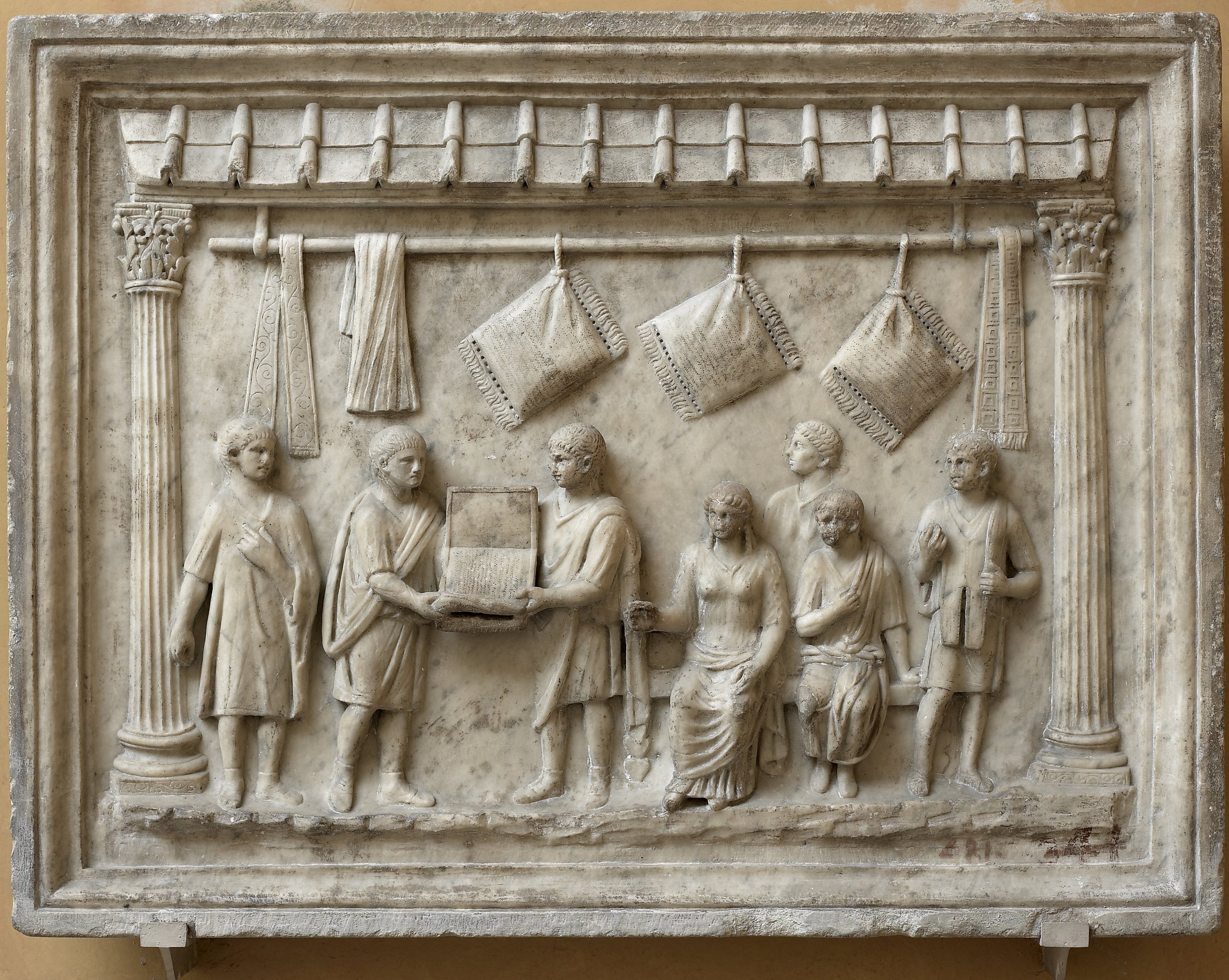 Rilievo con scena di vendita di cuscini - meta` I secolo d.C. (Fonte foto Galleria degli Uffizi)